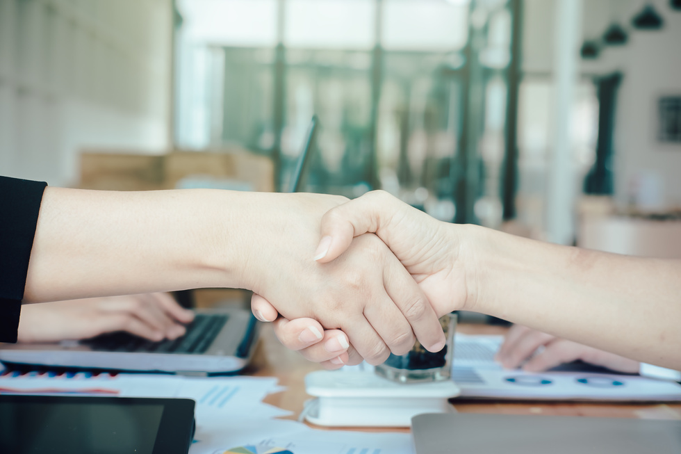 Handshake Between Business People in an Office